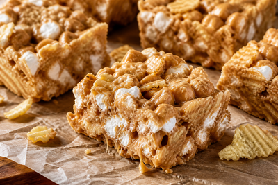 Gooey peanut butter marshmallow bars with crushed RUFFLES potato chips mixed in, cut into squares