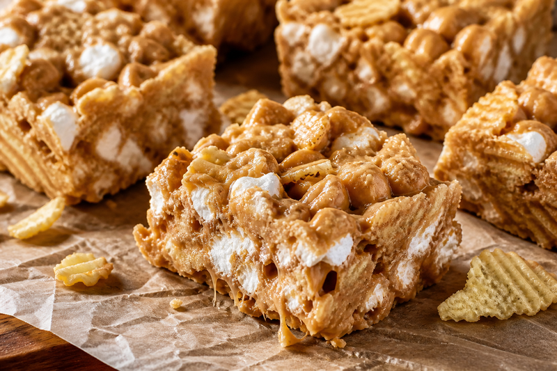 Gooey peanut butter marshmallow bars with crushed RUFFLES potato chips mixed in, cut into squares